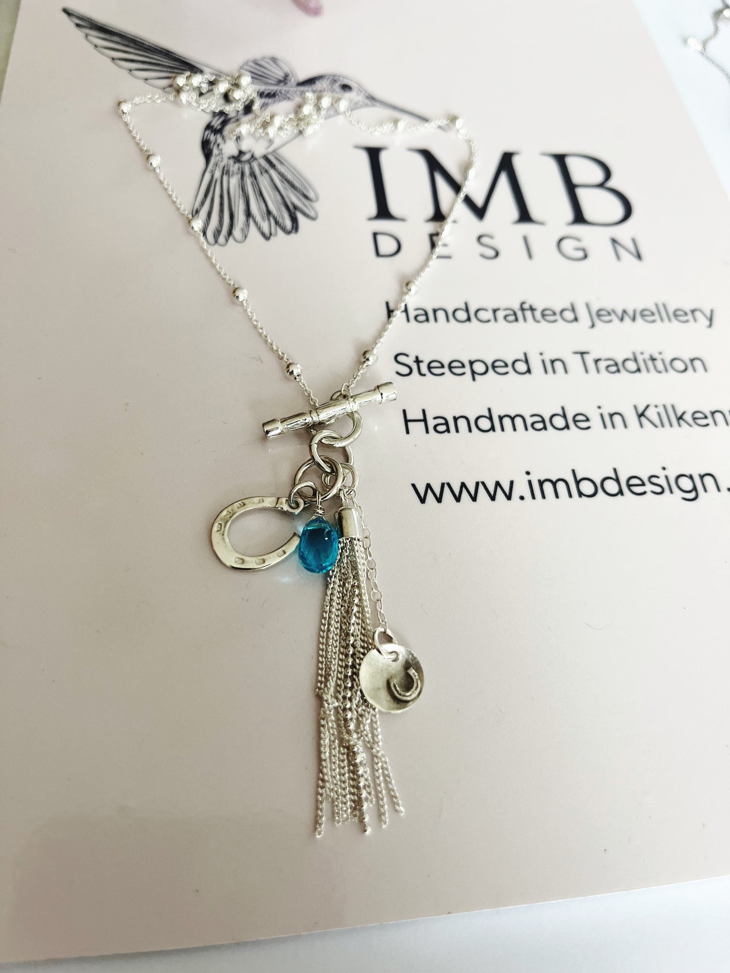 Blue horse shoe tassle