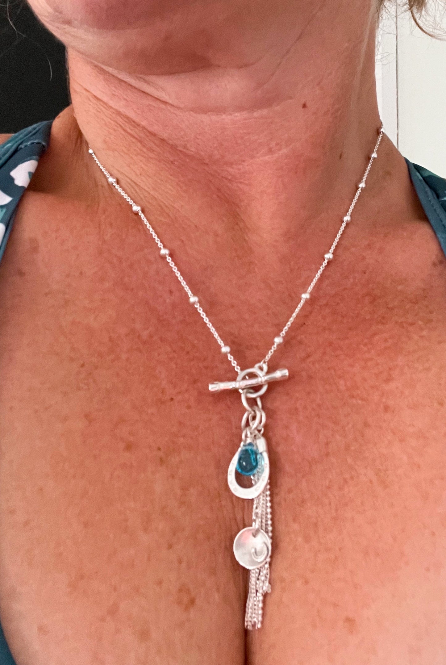 Blue horse shoe tassle