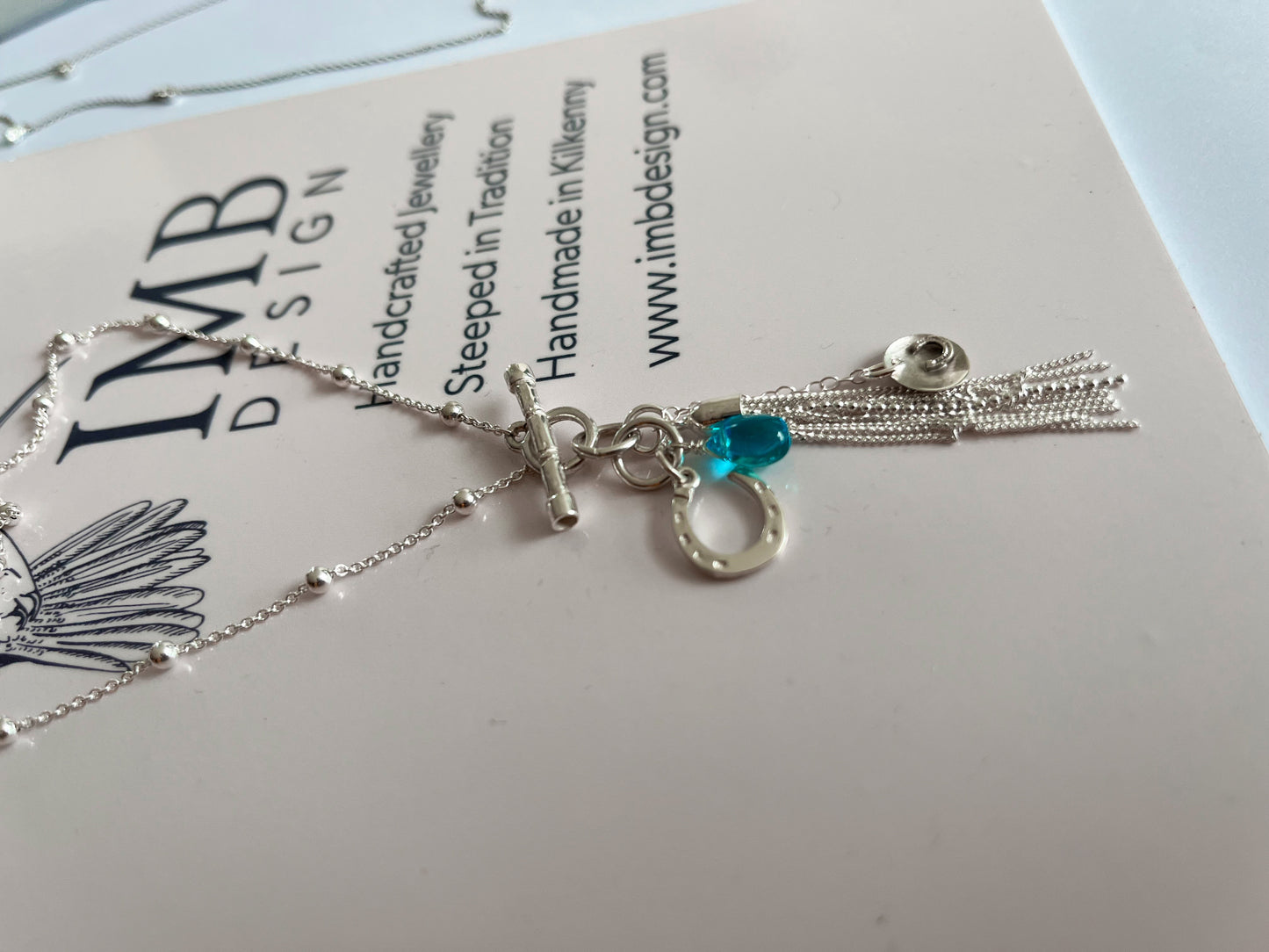 Blue horse shoe tassle